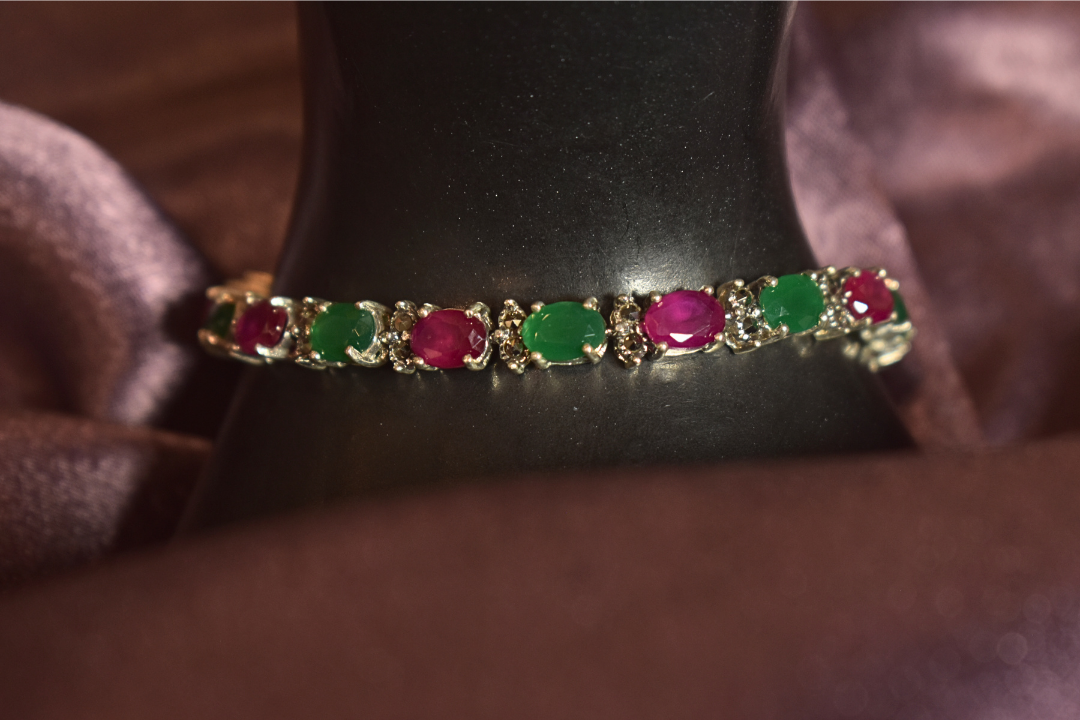 Silver hand chain With Emerald And Ruby Accent