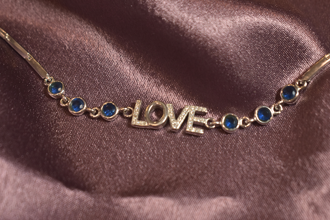 Love-Inspired Bracelet with Elegant Blue Accents