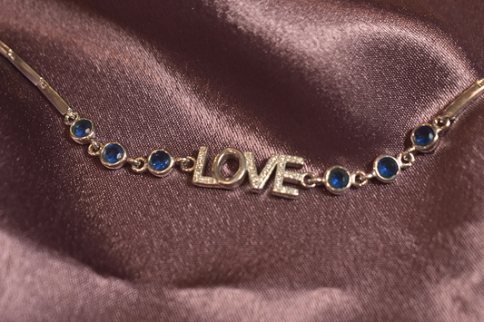 Love-Inspired Bracelet with Elegant Blue Accents