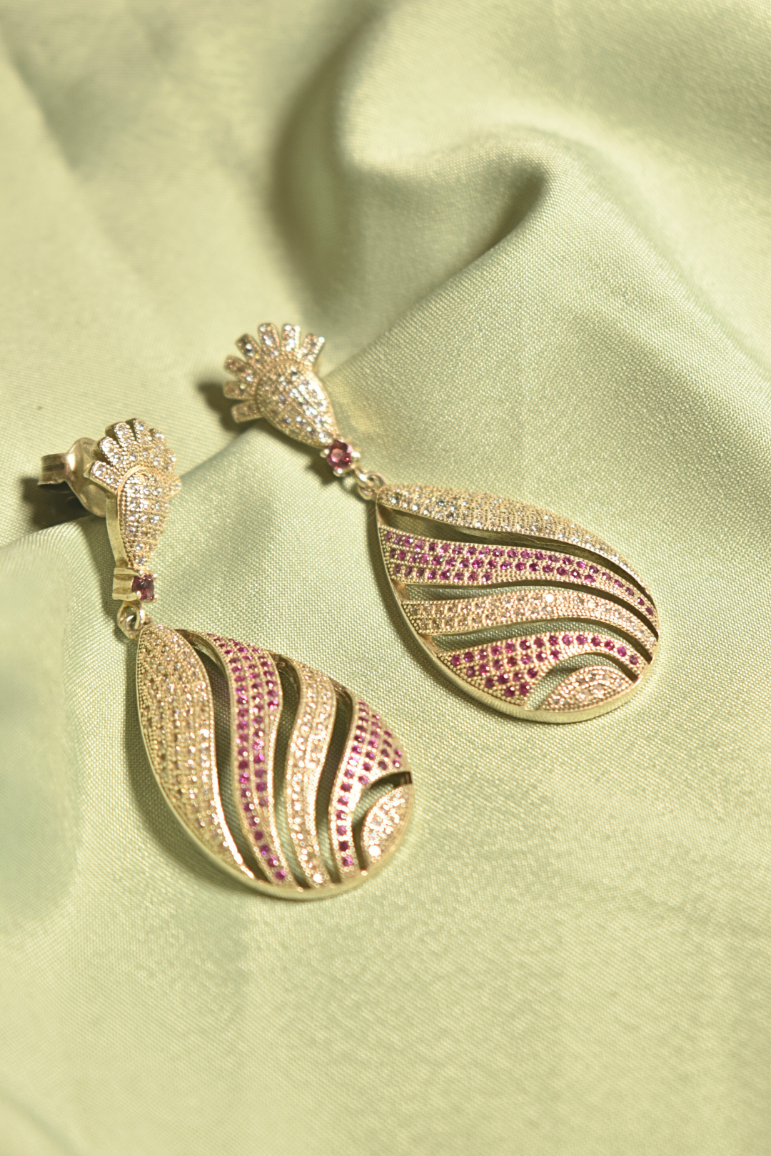 Elegant Waves Gold-Plated Teardrop Earrings with Ruby Accents