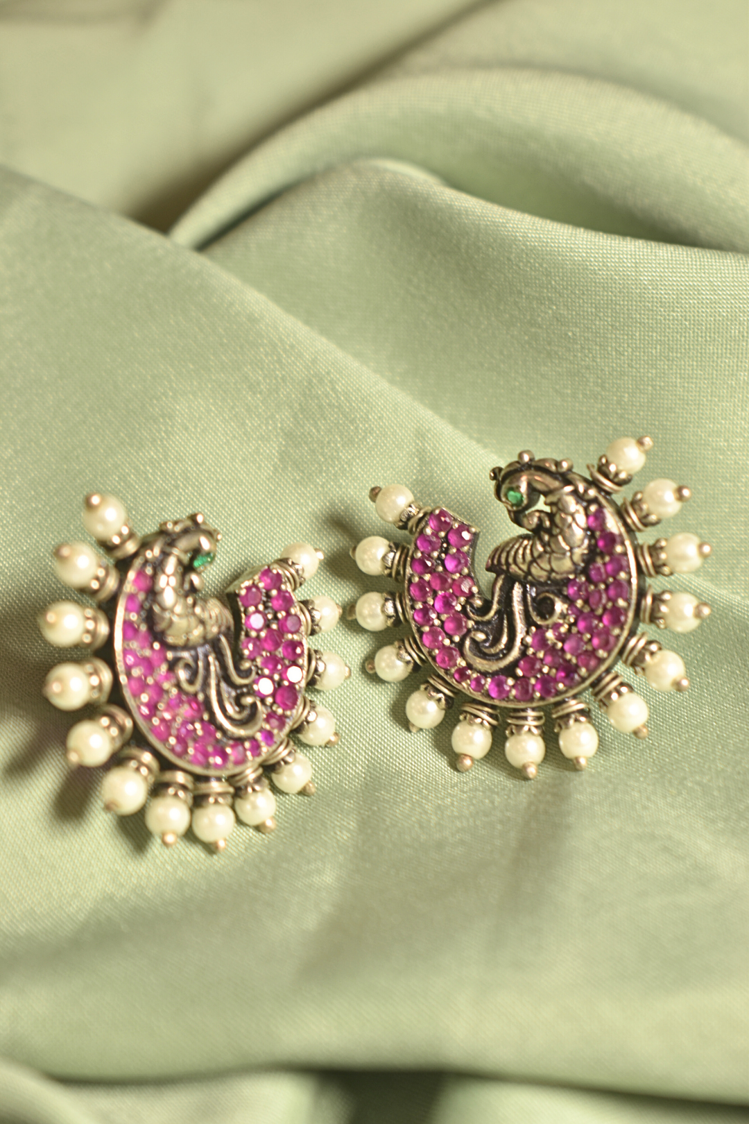 Peacock Majesty Ruby-Studded Crescent Earrings with Pearl Detailing