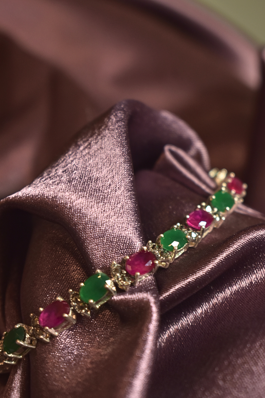 Silver hand chain With Emerald And Ruby Accent