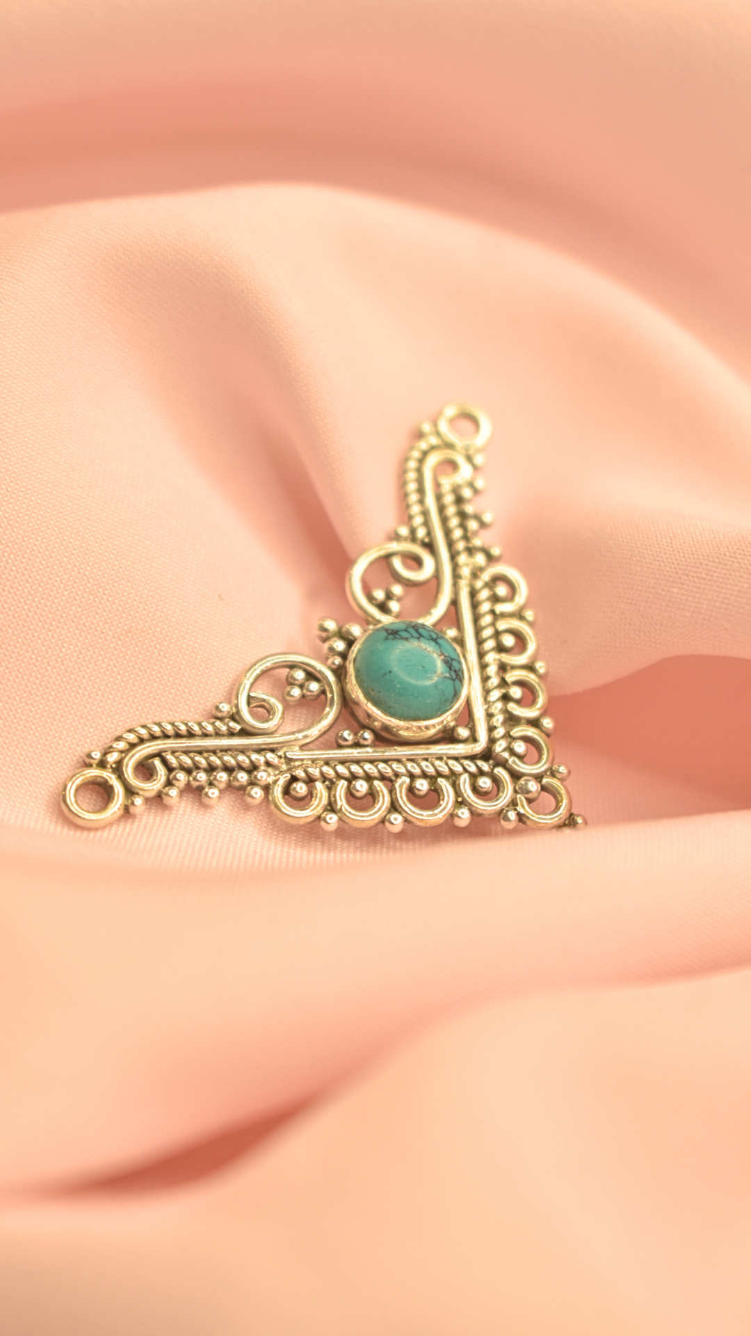 Elegant Turquoise Stone Pendant with Intricate Triangular Design