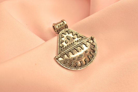 Traditional Silver Pendant with Geometric Patterns and Beaded Detailing