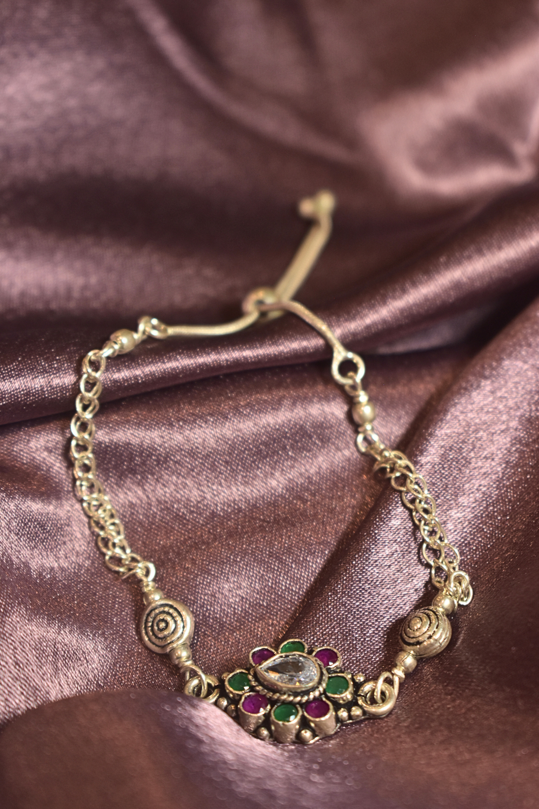 Traditional Floral Bracelet with Green and Pink Accents