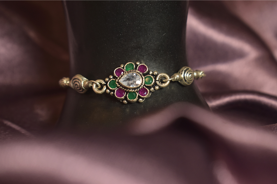 Traditional Floral Bracelet with Green and Pink Accents