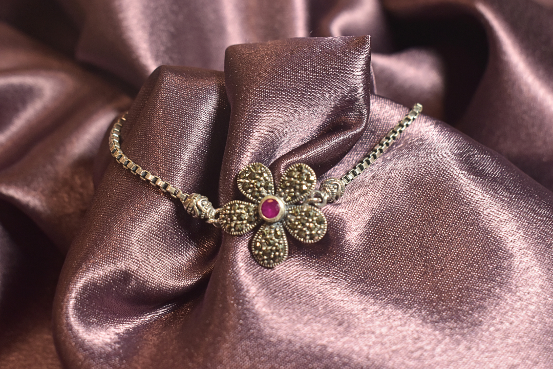 Vintage Floral Bracelet with a Ruby Centerpiece