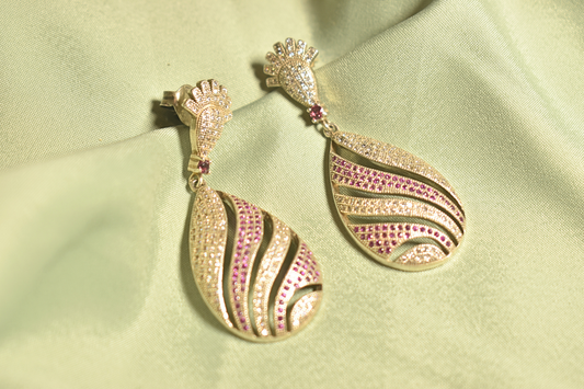 Elegant Waves Gold-Plated Teardrop Earrings with Ruby Accents