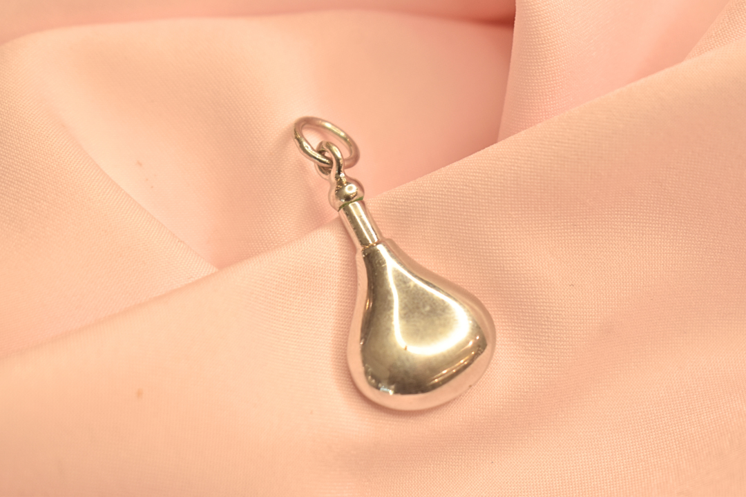 Delicate Gold Tone Pendant with Red Teardrop Stone