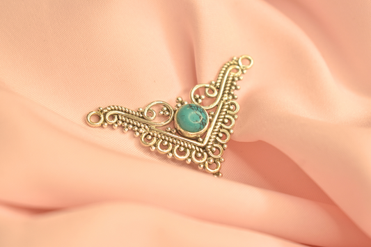 Elegant Turquoise Stone Pendant with Intricate Triangular Design