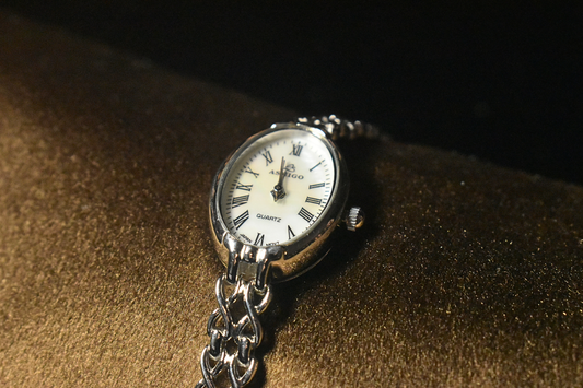 Classic Roman Numerals in a Sleek Oval Design