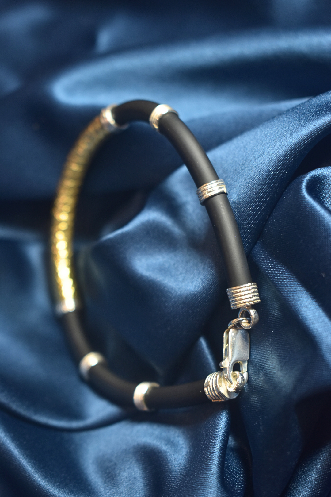 Modern Black and Gold Bracelet with Silver Detailing